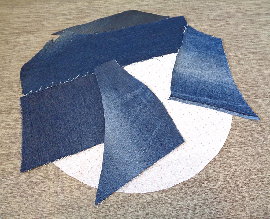 Layering the scraps to make denim patchwork
