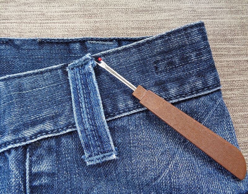 Removing the belt loop from jeans