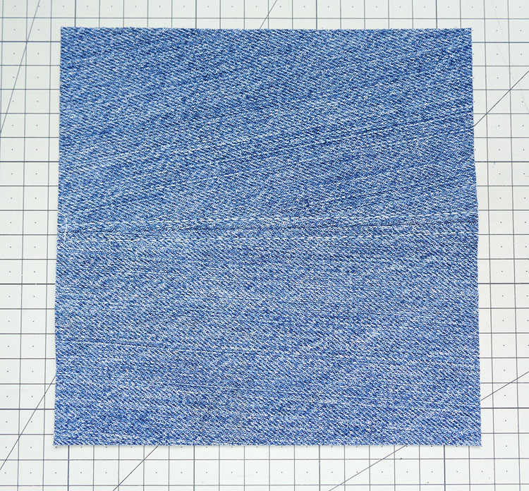 Denim pieces sewn together, which were not cut with the grain lines